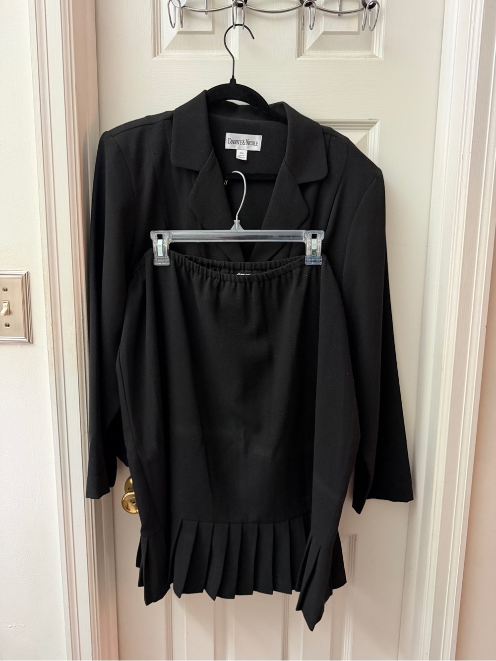 Danny & Nicole Black Two-Piece Long Sleeve Skirt Set with Pleated Hem